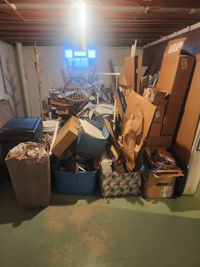 Roll-off dumpster container at job site for 4 Yard Dumpster Rental in St. Augustine Beach